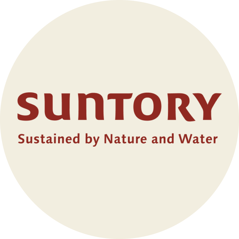 Suntory logo with the tagline Sustained by Nature and Water on a cream circular background