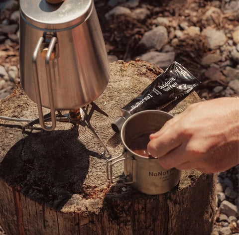 NoNormal Outdoor Coffee Kit with Colombian coffee paste and 380 ml titanium cup prepared outdoors while camping