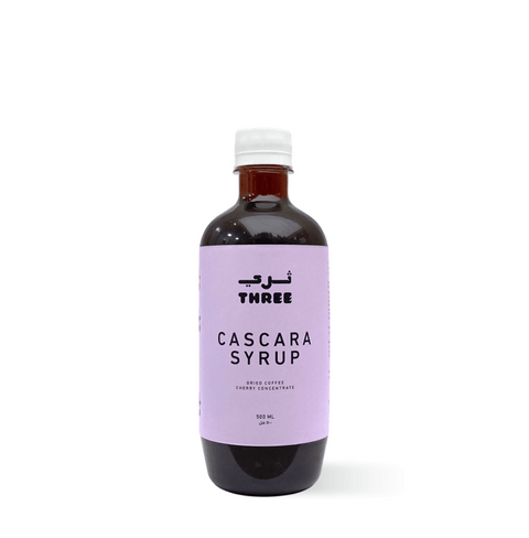 Bottle of organic Cascara Syrup ideal for summer drinks in UAE, made with purified water and cascara pods, on a plain background.