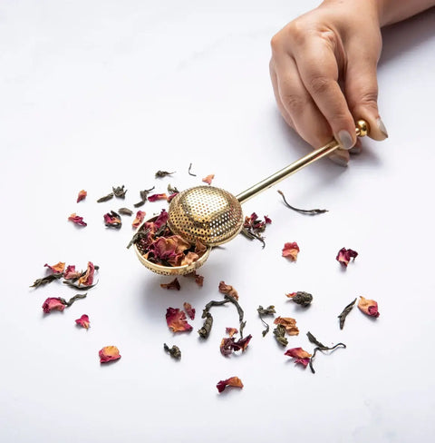 Elegant gold modern fine mesh tea infuser for precise and flavorful loose-leaf tea brewing.