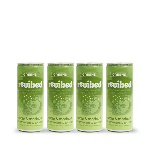 Four green cans of revibed Greens drink on a white background