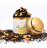 JPremium OH CHA Jasmine loose leaf green tea with dried jasmine blossoms in decorative metal tea canister.