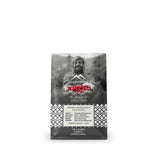 A bag of Copperwood Tea & Coffee Blend Yemen Coffee on a plain white background. The packaging is primarily dark gray and black with a grayscale photo of a man holding red coffee cherries, and a white patterned band at the bottom.
