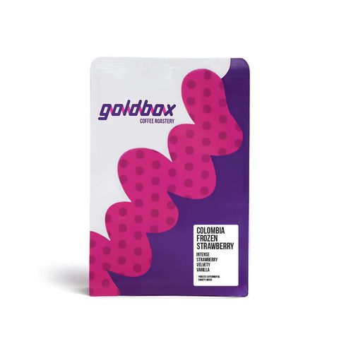 Packaging of Colombia Frozen Strawberry coffee from Goldbox Coffee Roastery with vibrant design and flavor notes.