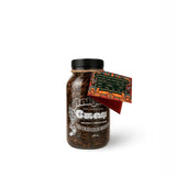 A glass jar of RMM Coffee Co. G-550 Specialty Indian Coffee from Riverdale Estate, filled with dark roasted coffee beans, featuring a black lid, a decorative twine tag, and an attached orange and green label, set against a plain white background.
