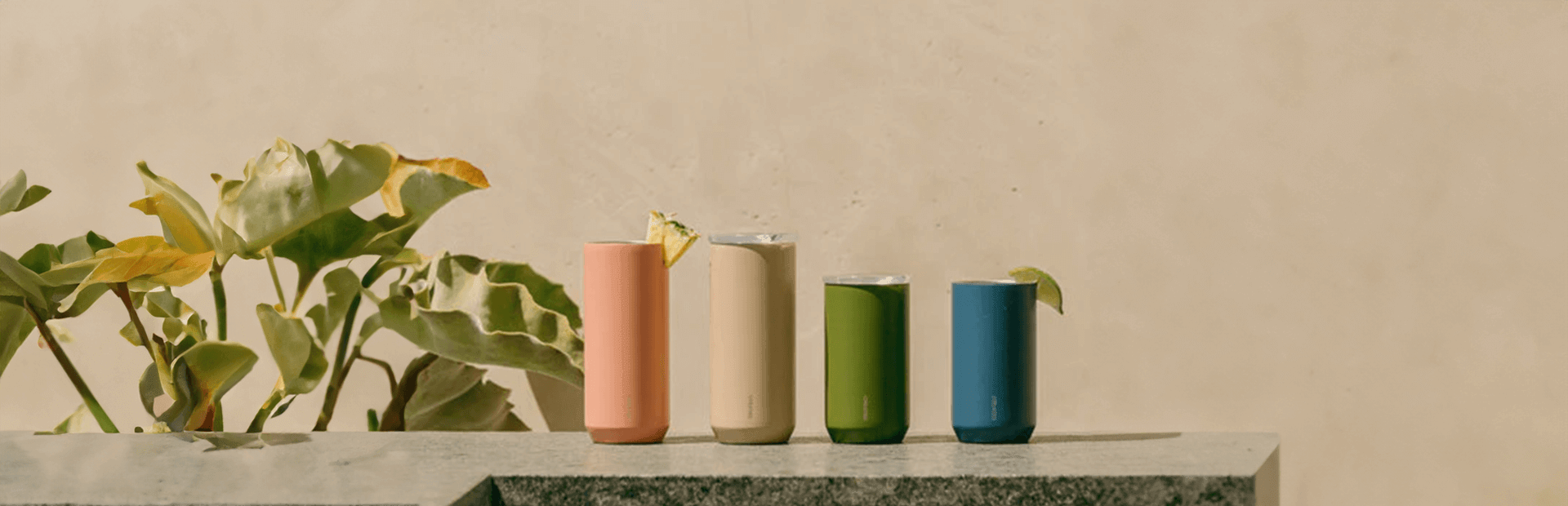 Colorful drinkware collection on a stone surface, perfect for coffee, matcha, and tea lovers in Dubai, UAE.