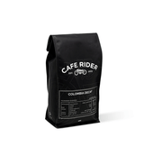Cafe Rider Roastery's Colombia Decaf coffee with peach, maple syrup, and chocolate notes, decaffeinated using sugarcane E.A. method.