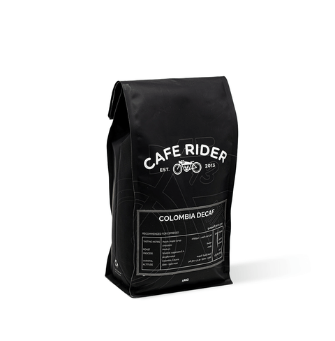 Cafe Rider Roastery's Colombia Decaf coffee with peach, maple syrup, and chocolate notes, decaffeinated using sugarcane E.A. method.