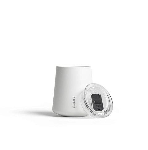 Ceramic Coated Wine Cup with a lid, showcasing its sleek design and practical features for elegant sipping.