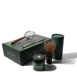 Midori Spring Gold Matcha gift box with 30g tin, purple bamboo whisk, scoop, sifter, and wooden accessories for a premium experience.