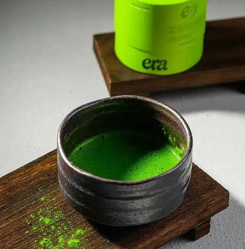 Ceremonial Matcha - Uji, Kyoto in a rustic bowl, showcasing vibrant green color and rich texture.
