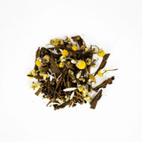 Loose-leaf Chamomile Hojicha blend featuring organic chamomile flowers and roasted tea leaves.