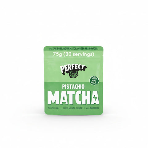 PerfectTed Pistachio Matcha Powder in a bowl with a bamboo whisk