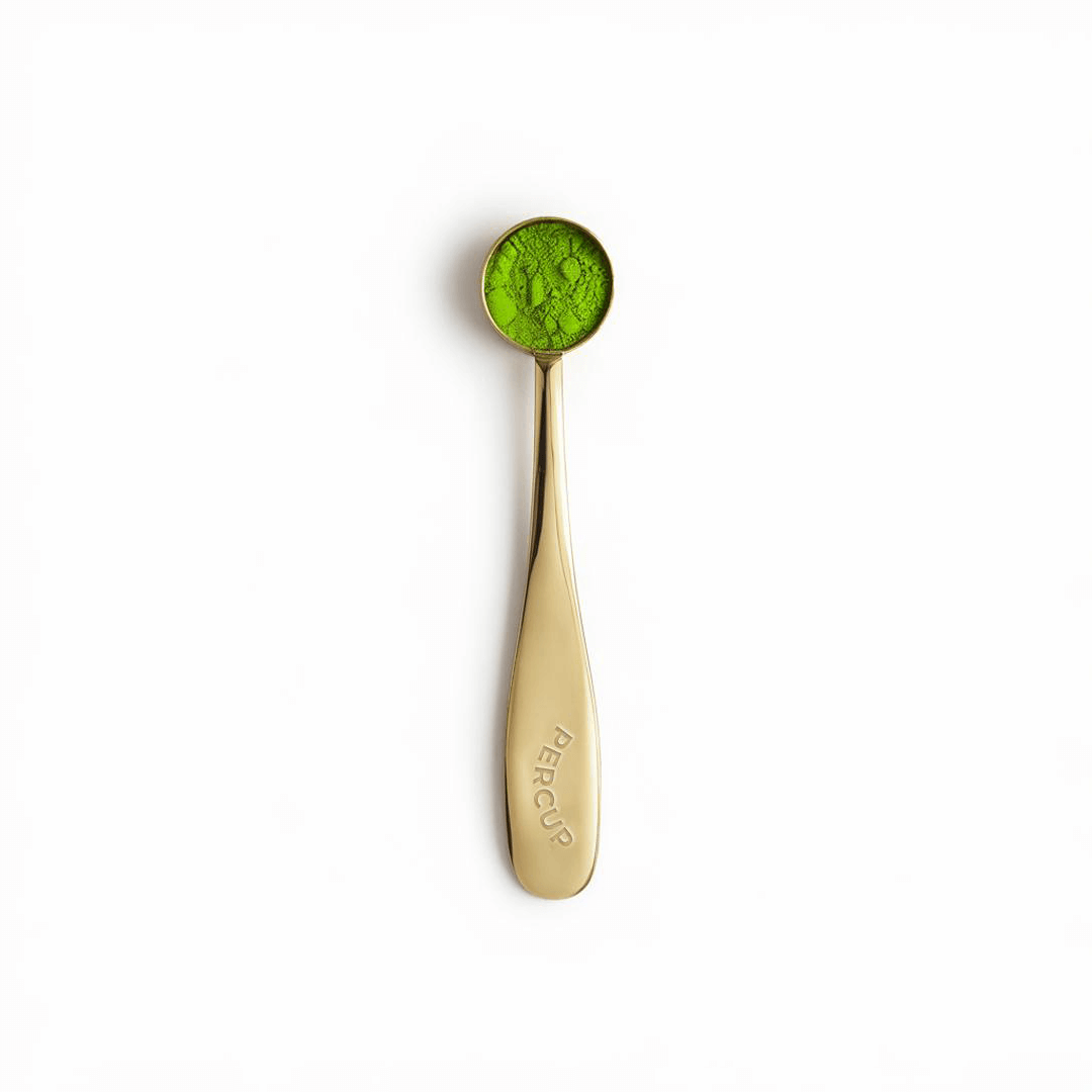 Matcha Serving Spoon in gold finish with matcha powder, perfect for precise measurements and elevating tea experience.