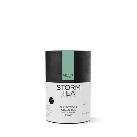 Gunpowder Green Tea with Mint in a cylindrical packaging with branding and mint leaf illustrations, perfect for a refreshing brew