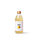 Bottle of Kimino Yuzu Sparkling Juice made with Shikoku yuzu and mountain spring water.