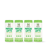 Four cans of Human Tea Matcha Latte Oat Drink on a white background