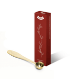 Matcha Serving Spoon in gold finish next to elegant packaging, perfect for precise tea measurements.