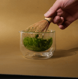 Hand-blown glass mug for whisking, sipping, and serving. Sleek, versatile, and comfortable design for daily use.