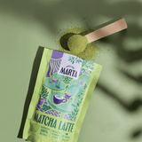 Organic Matcha Latte powder packaging with a wooden scoop, showcasing 100% organic ingredients.