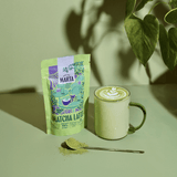 Organic Matcha Latte by Atelier Marta, featuring latte powder, cup, and matcha spoon.