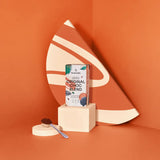 Original Choc Blend chocolate with Himalayan salt packaging on geometric orange backdrop