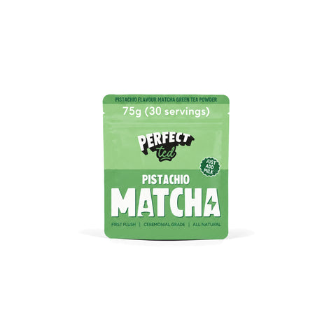 PerfectTed Pistachio Matcha Powder in a bowl with a bamboo whisk