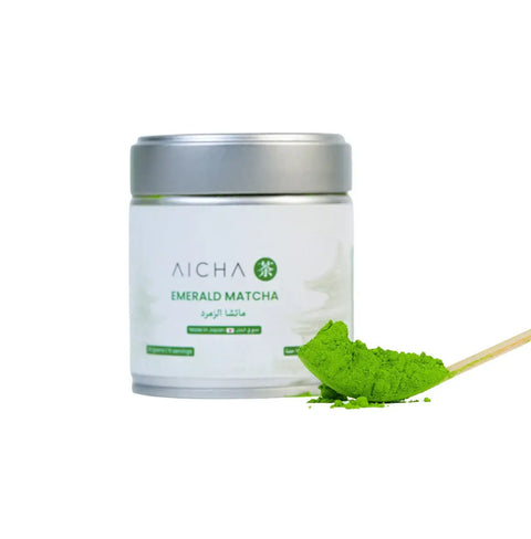 Emerald Matcha ceremonial-grade tea in a tin with vibrant green matcha powder and spoon