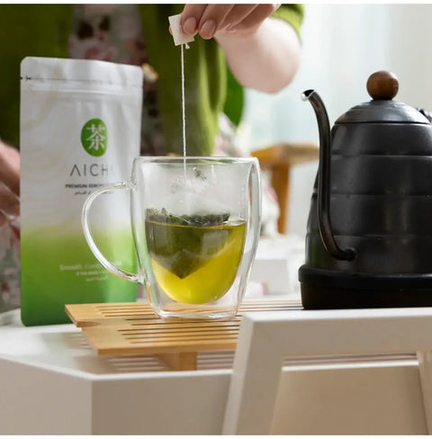 Premium Sencha Tea Bags brewed in a glass cup with Kyoto Uji tea, deep umami, and smooth taste