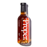Caramel Syrup bottle by Proper showcasing natural syrup made from cane sugar and organic agave.