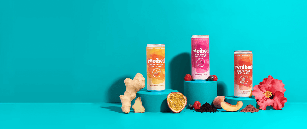 Refreshing flavored sparkling beverages by Rejuiced, featuring ginger, tropical fruits, and vibrant colors.