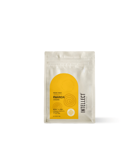 Rwanda Karisimbi Single Origin Specialty Coffee in a yellow packaging by Intellect Coffee, showcasing medium roast.