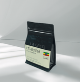 Ethiopia Guji Hambela coffee bag featuring natural processing and tasting notes of chocolate and fruit.