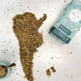 Traditional Yerba Mate shaped from yerba mate leaves with packaging in view.