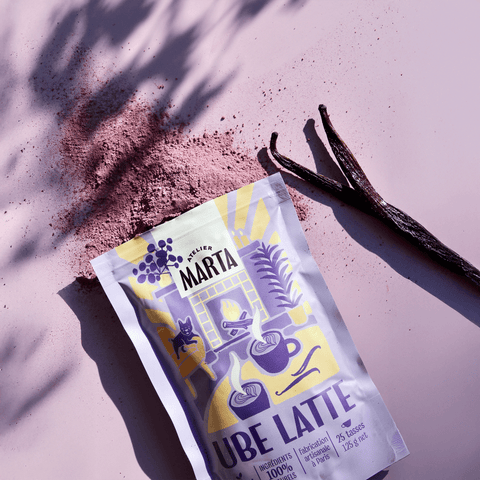 Atelier Marta Ube Latte powder package with natural ingredients on a pink background.