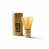 White Bamboo Chasen — Matcha Whisk in a stylish gold container, perfect for blending matcha and enhancing tea rituals.