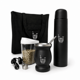 Black Tuma mate set with thermos, cup, and accessories on a black background