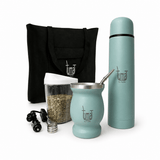 Teal Yerba Mate set with cup, thermos, and accessories on a blue background