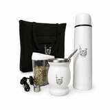Collection of Tuma products including a thermos, cup, and bag on a white background